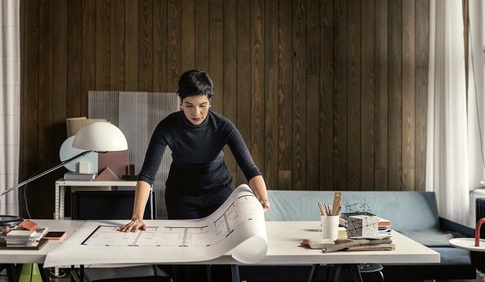 Woman with architectural plans